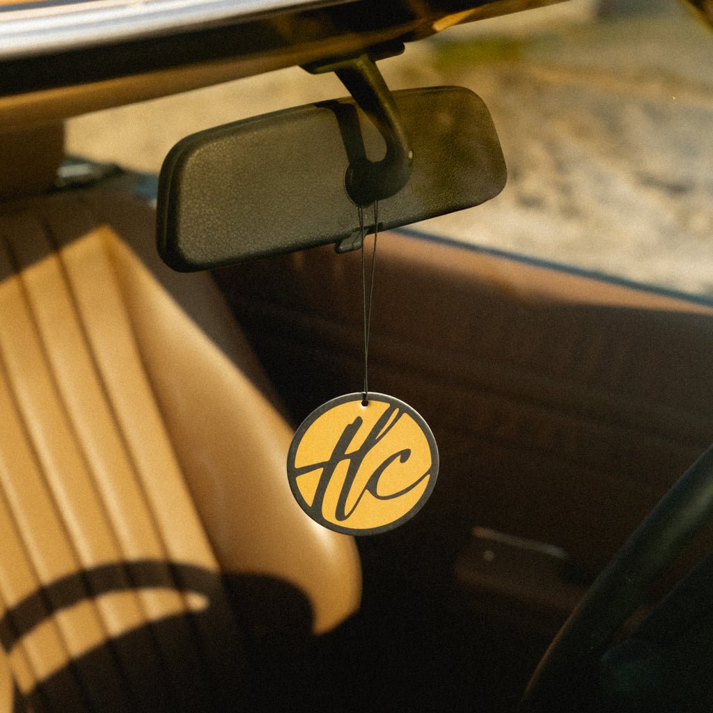 Boardwalk fragrance card hanging in car freshening air with warm scent